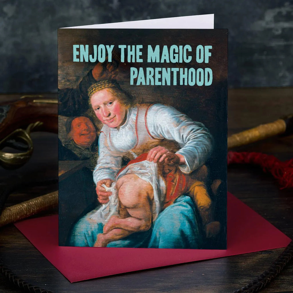 Greeting card with vintage-style illustration of a woman holding a child, text 'Enjoy the Magic of Parenthood', on a dark background.