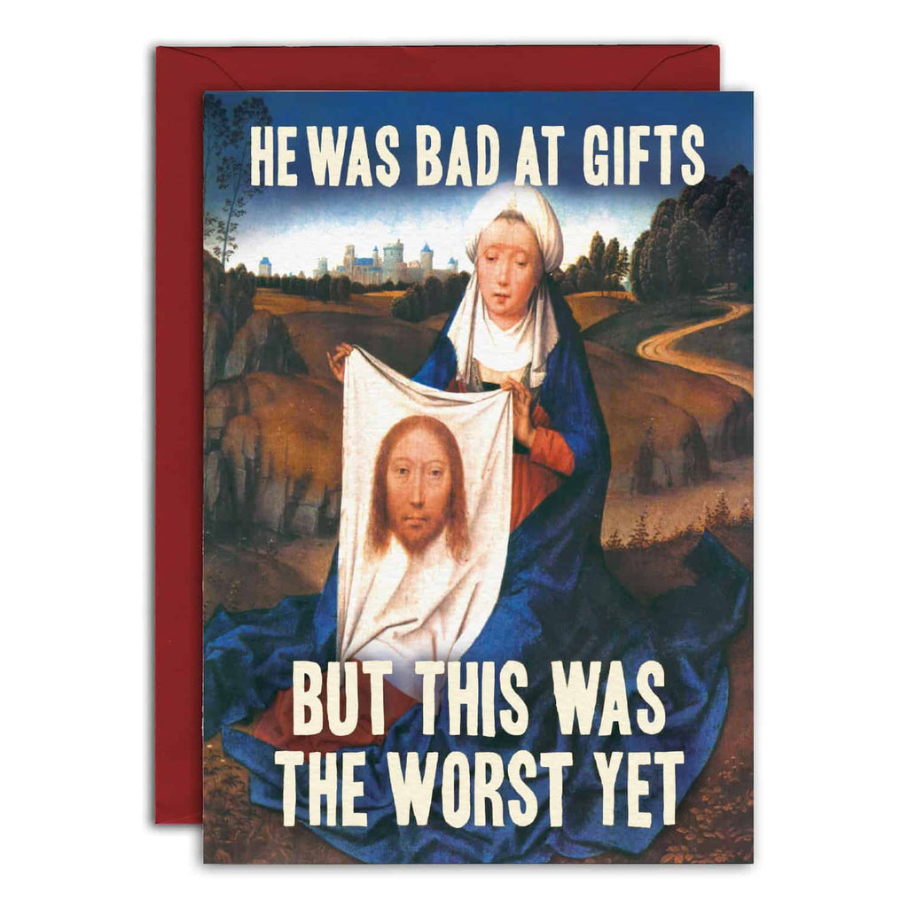 Card with classical painting of a woman holding a cloth with a face, text 'He was bad at gifts but this was the worst yet', red envelope.