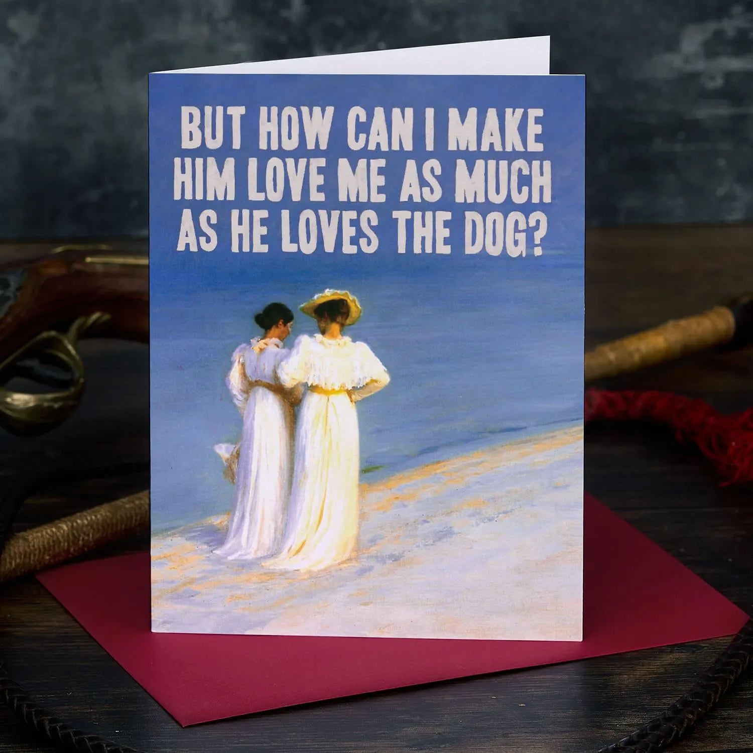 Card with vintage painting of two women on a beach and humorous text.