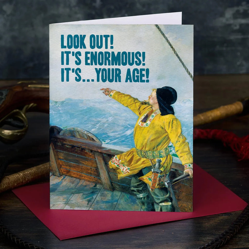Birthday card with a person in a yellow coat on a ship and humorous text.