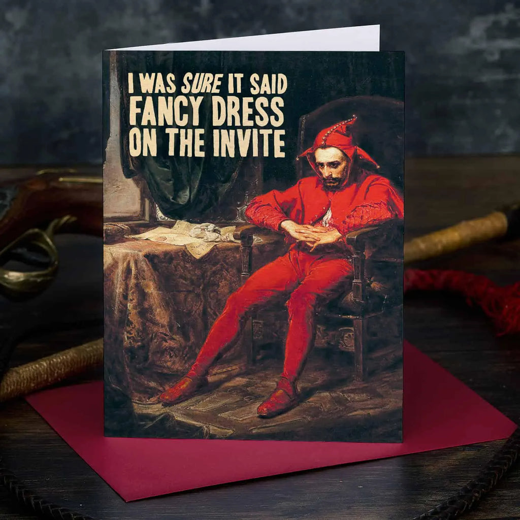 Greeting card with a person in red attire and humorous text on a dark background