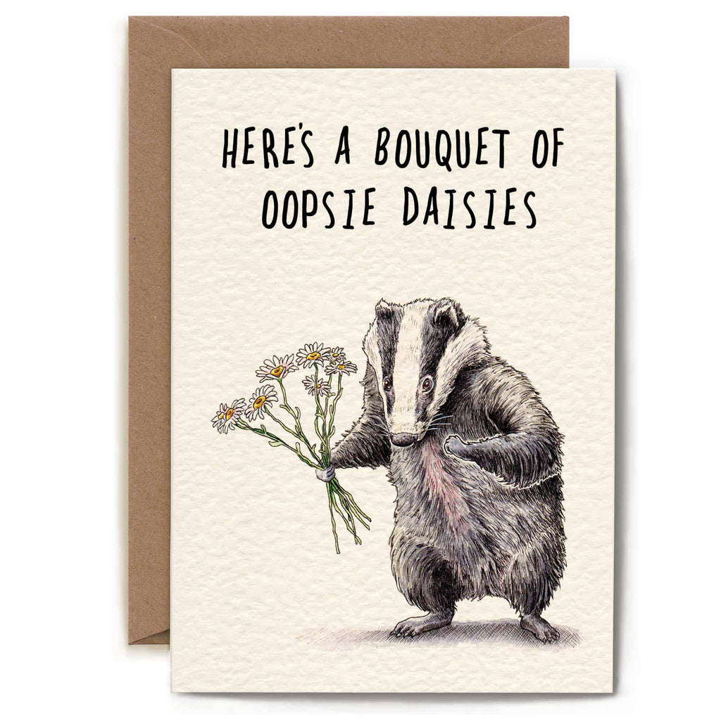 Card with a badger holding flowers and text 'Here's a bouquet of oopsie daisies' on a white background.