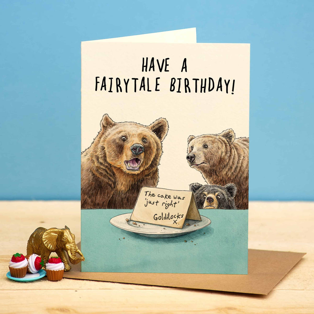 Birthday card with bears and a cake, featuring the text 'Have a fairytale birthday! The cake was just right Goldilocks'.