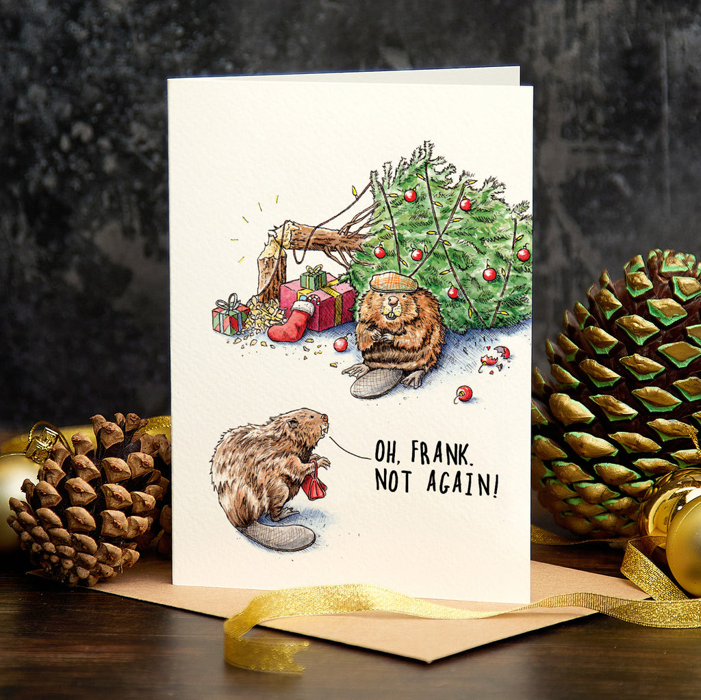 Christmas card with beaver illustration and humorous text, surrounded by pine cones and a gold bow.