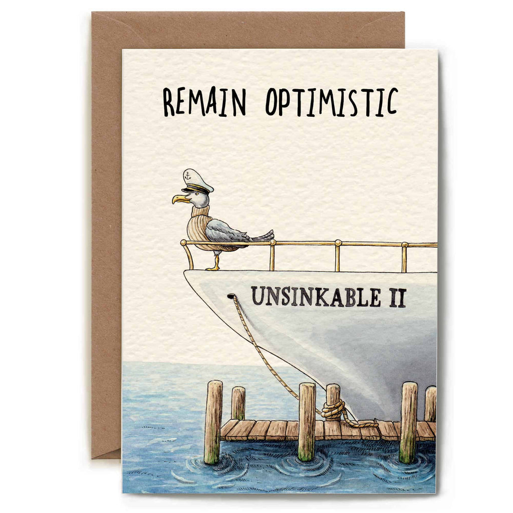 Card with a seagull on a ship named 'Unsinkable II' and text 'Remain Optimistic' on a white background.