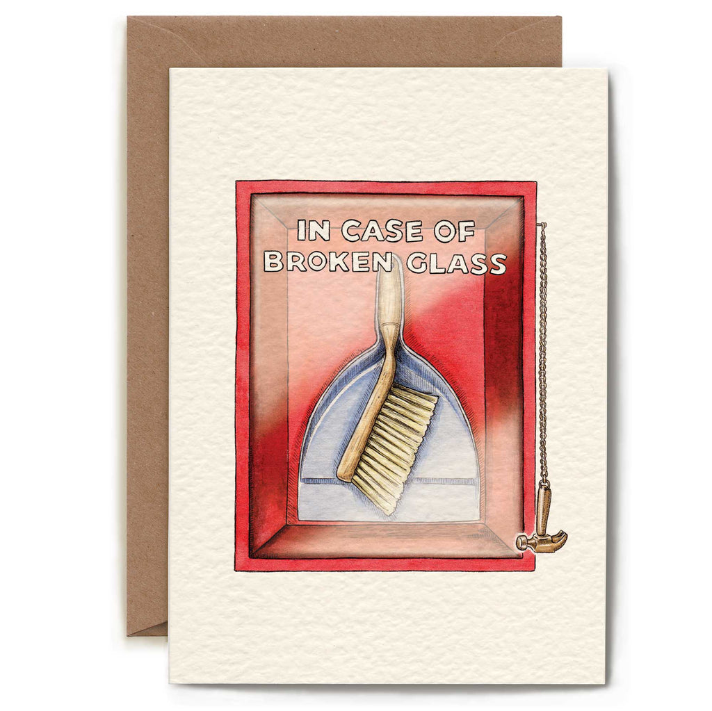 Greeting card with a brush and pan illustration and text 'In Case of Broken Glass' on a red background.