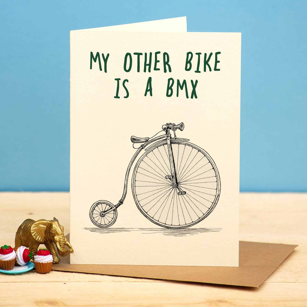 Card with vintage bicycle illustration and text 'My other bike is a BMX' on a blue background