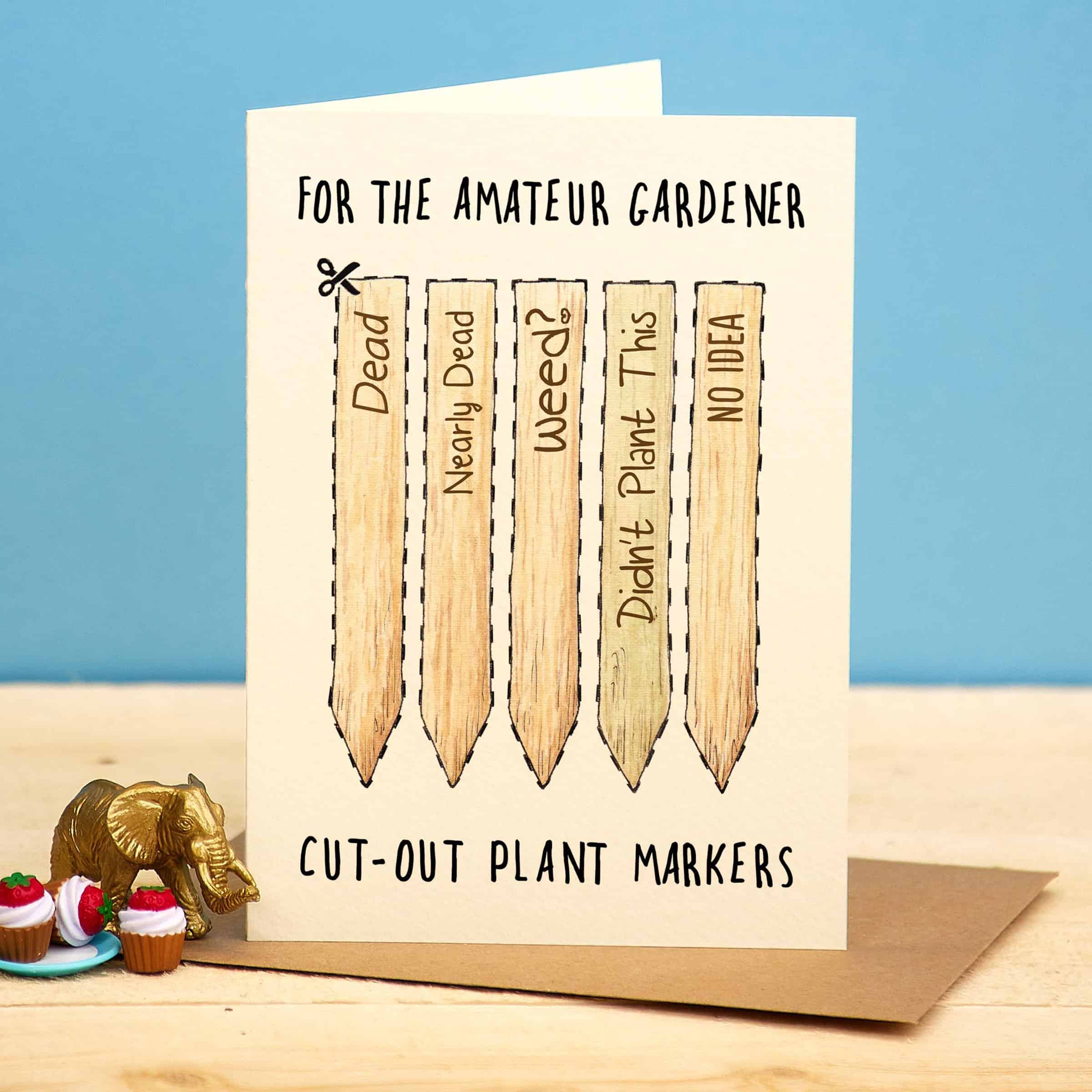 Card with cut-out plant markers and humorous text on a blue background
