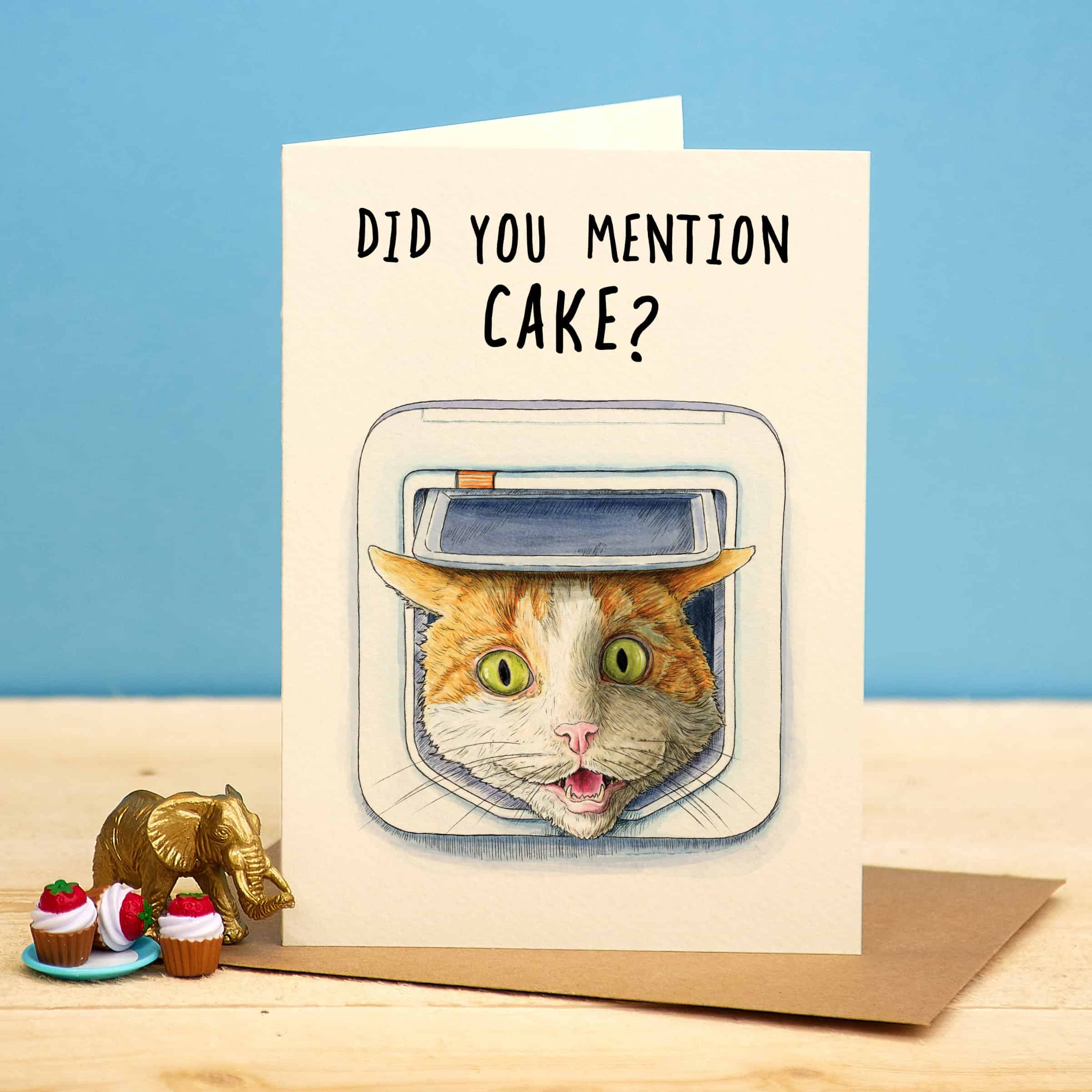 Card with a cat illustration and text 'Did you mention cake?' on a blue background