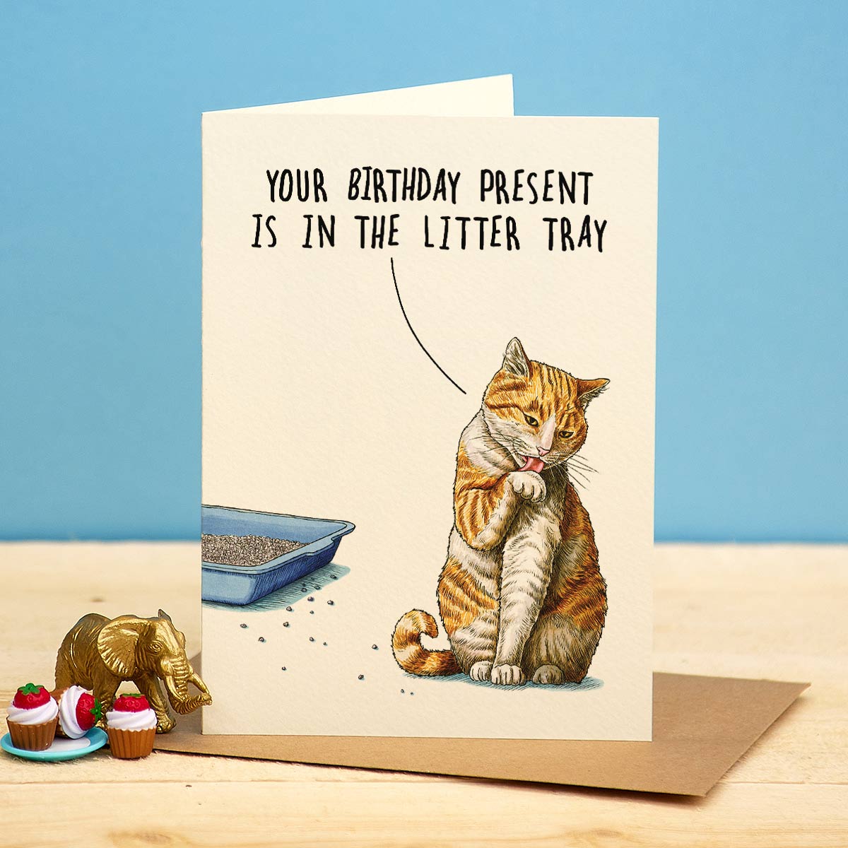 Card with a cat illustration and humorous text on a blue background