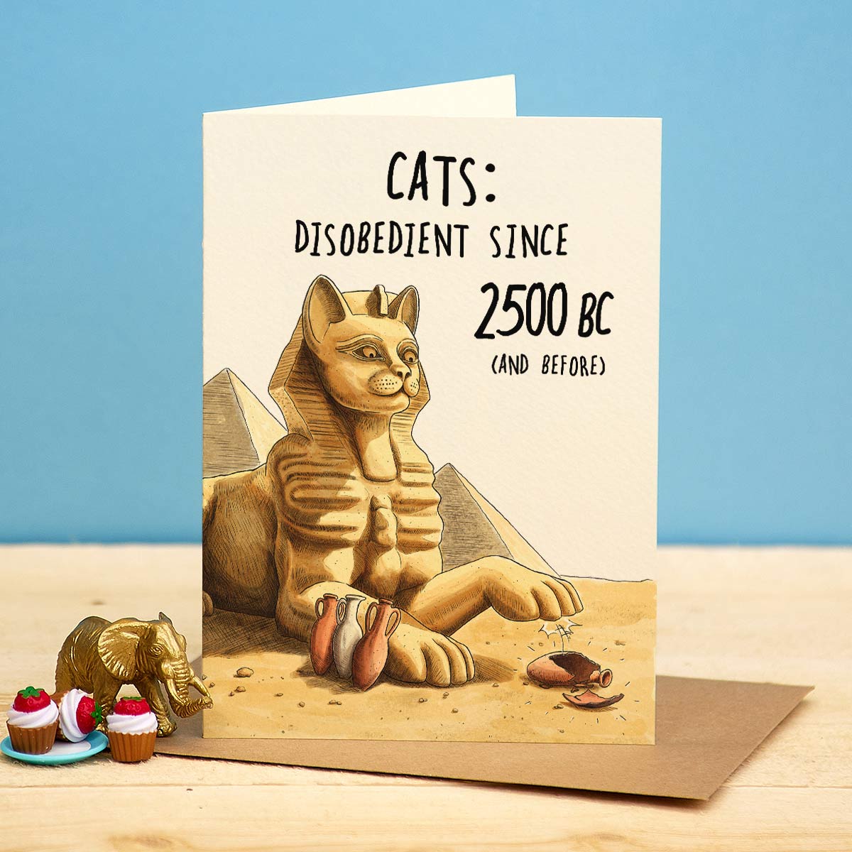 Card with a cat-themed illustration and text on a blue background