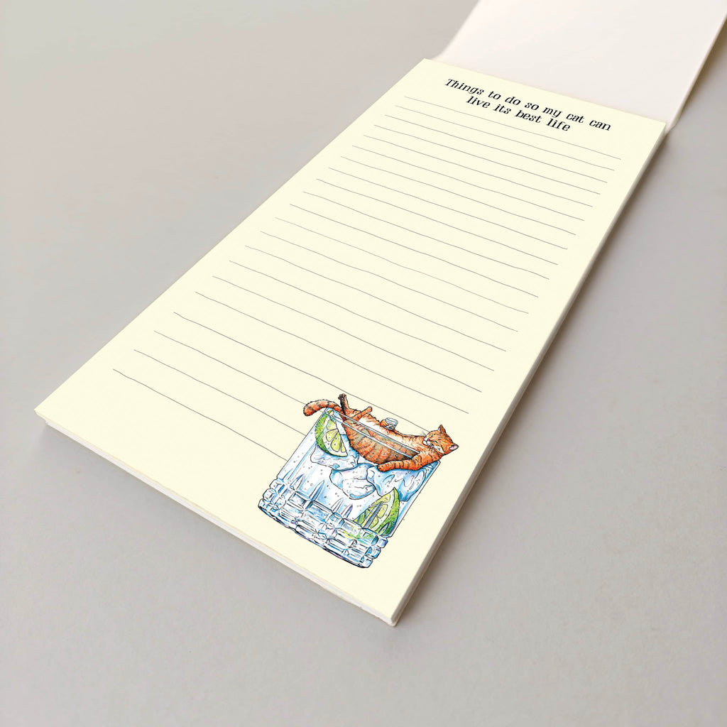 Notepad with a cat illustration and text on a gray background
