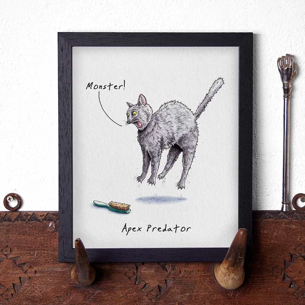Illustration of a cat labeled 'Apex Predator' on a wooden surface.