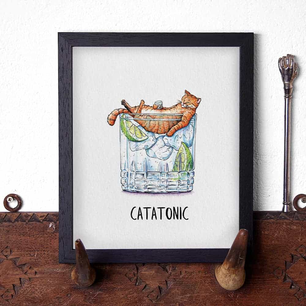 Artwork of a cat in a glass with the word 'Catatonic' on a white background.