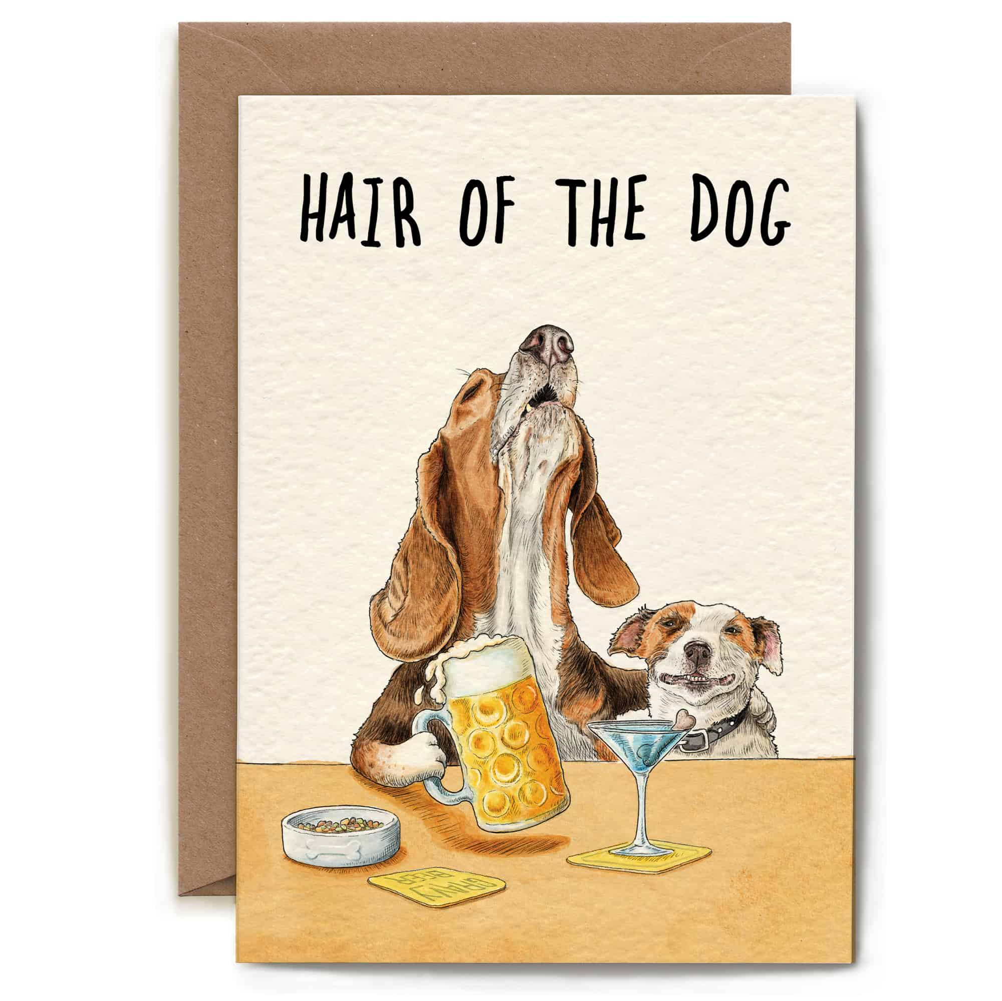 Greeting card with illustration of two dogs at a bar, one holding a beer mug, with 'Hair of the Dog' text above.