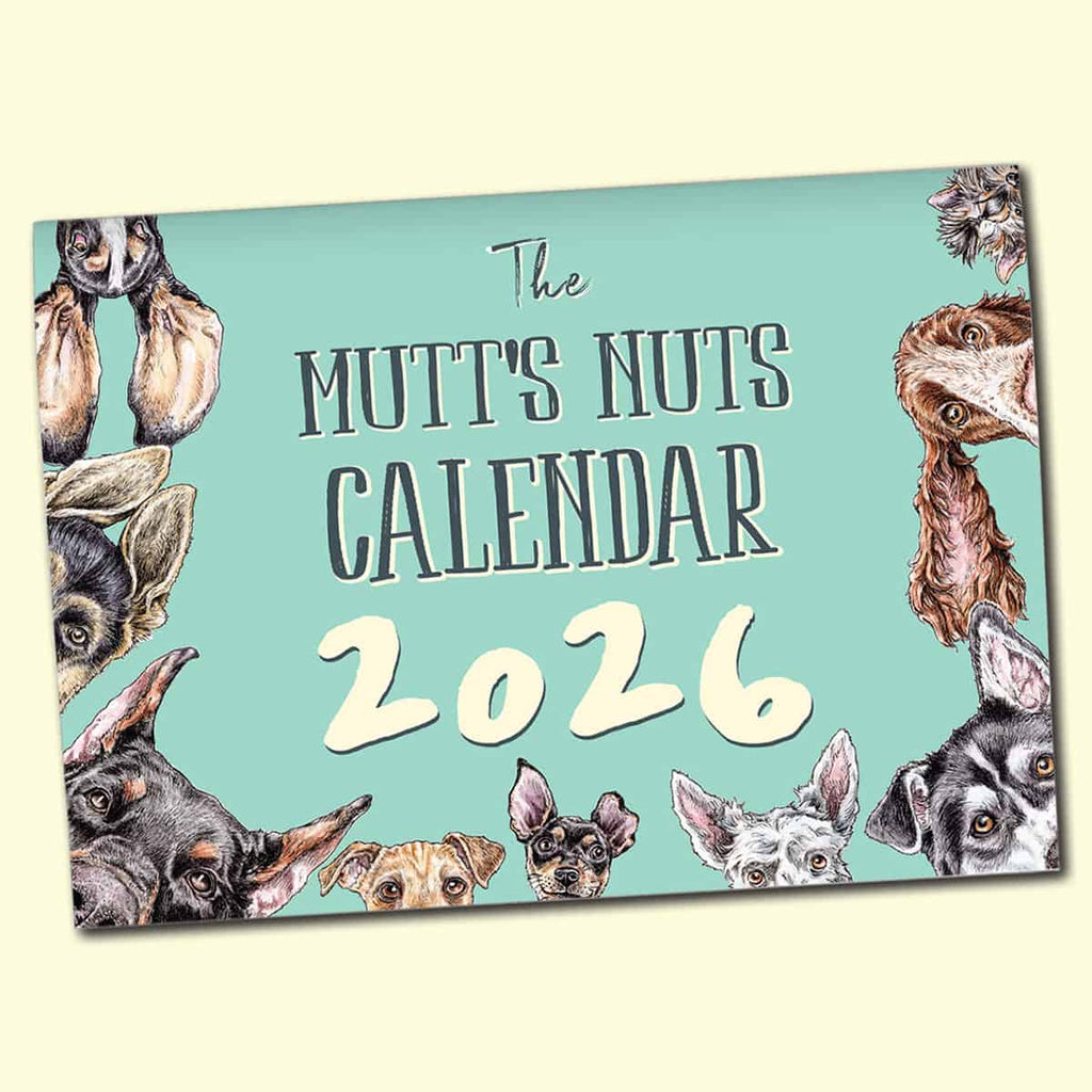 Calendar cover for 'The Mutt's Nuts Calendar 2026' with images of dogs on a light blue background.