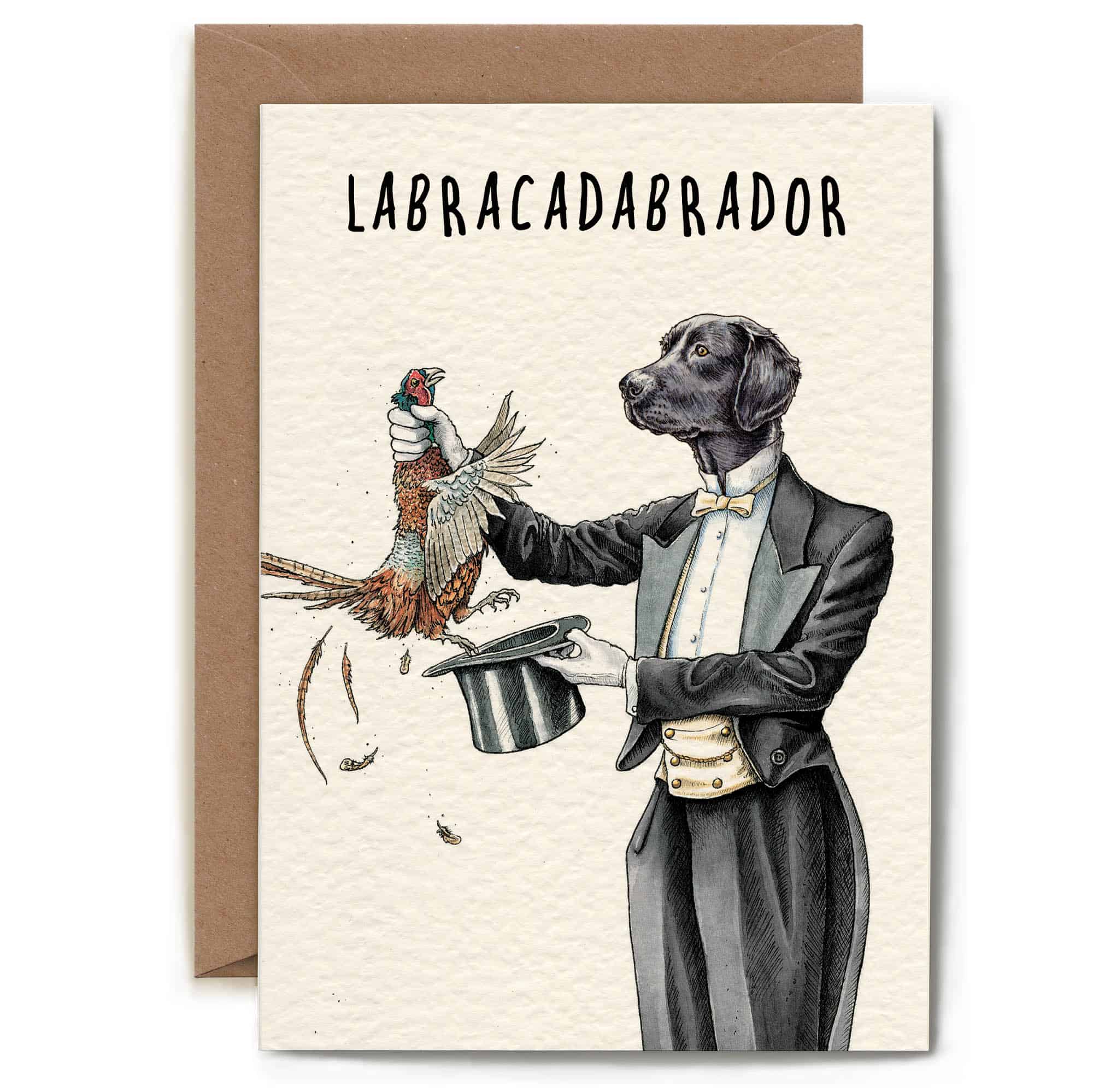 Card with a dog in a tuxedo holding a bird, labeled 'Labracadabrador', on a beige background.