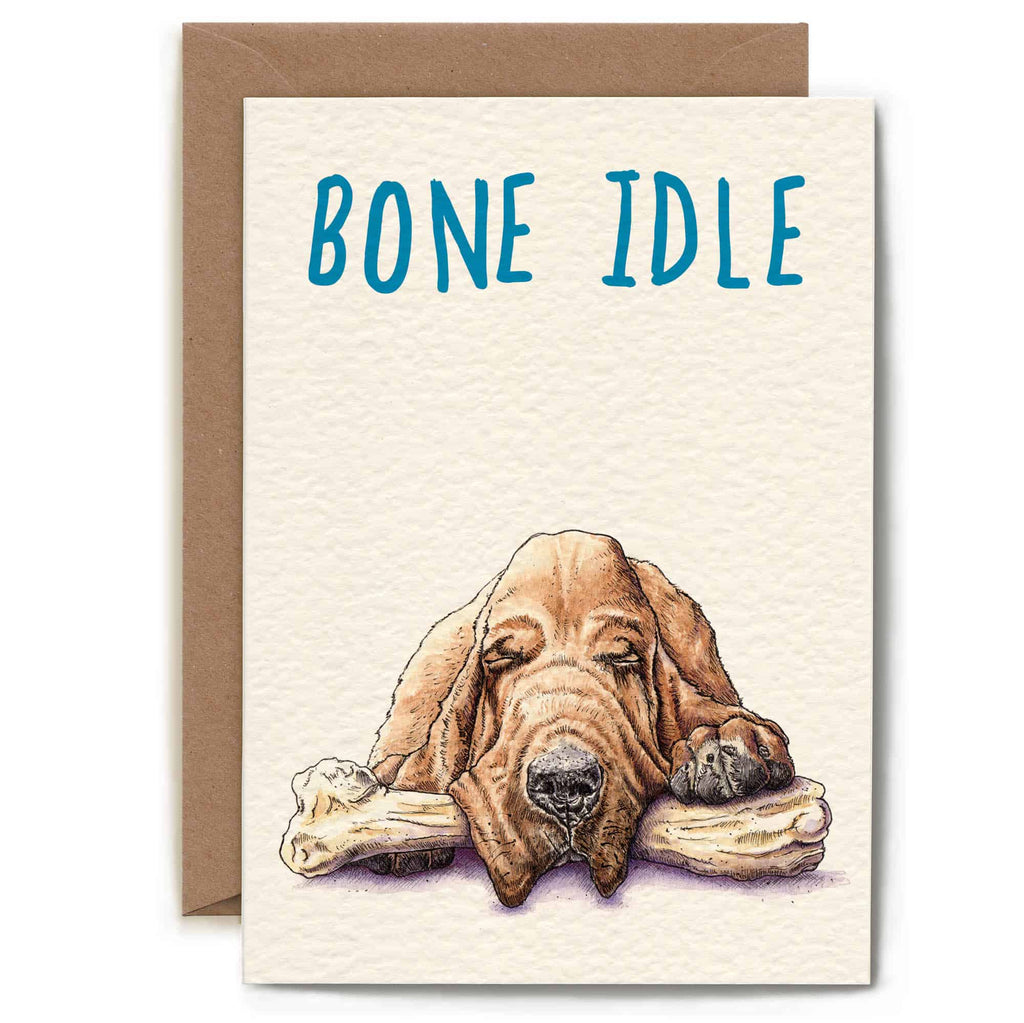 Greeting card with a dog illustration and 'Bone Idle' text on a white background