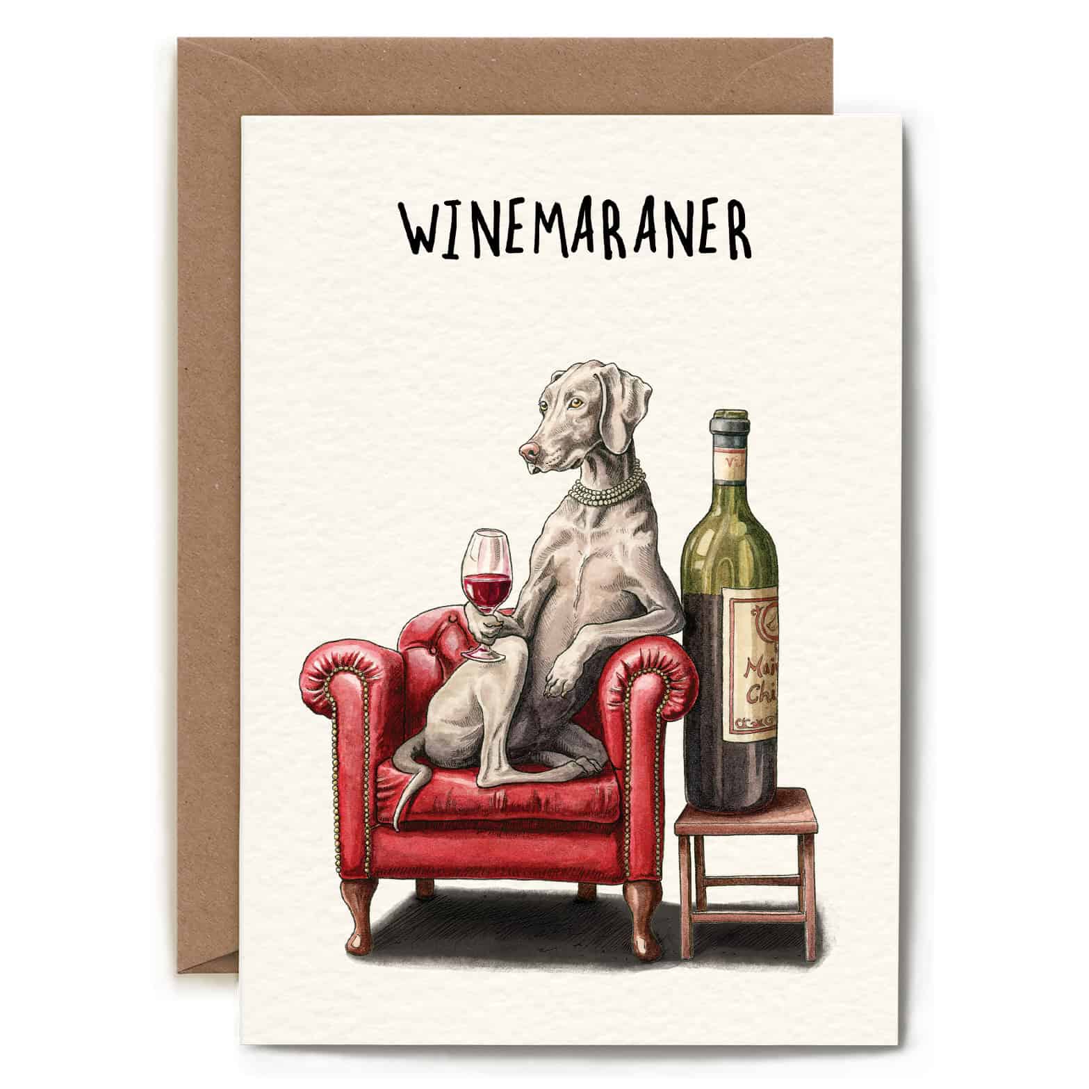 Greeting card with a dog sitting on a red armchair with a wine bottle and glass, labeled 'WINEMARANER'.