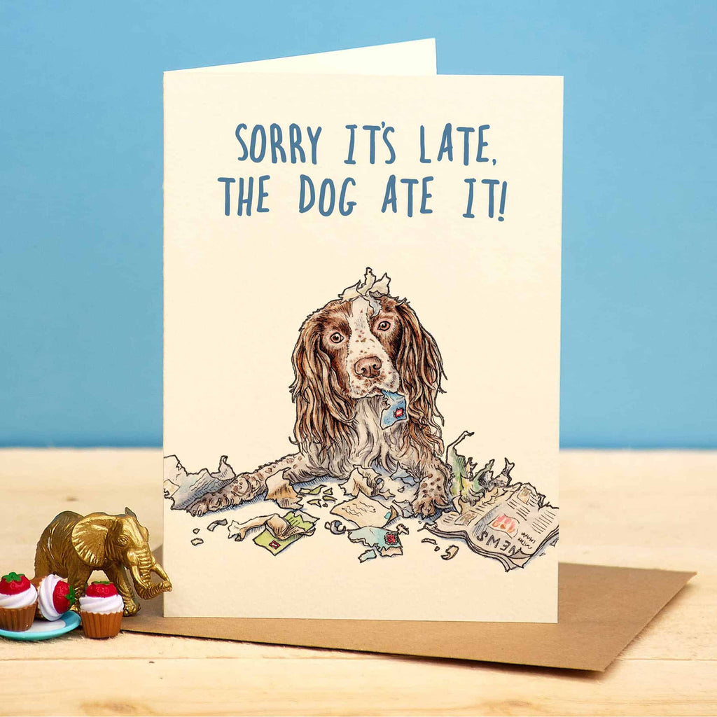 Card with a dog illustration and text 'Sorry it's late, the dog ate it!' on a blue background