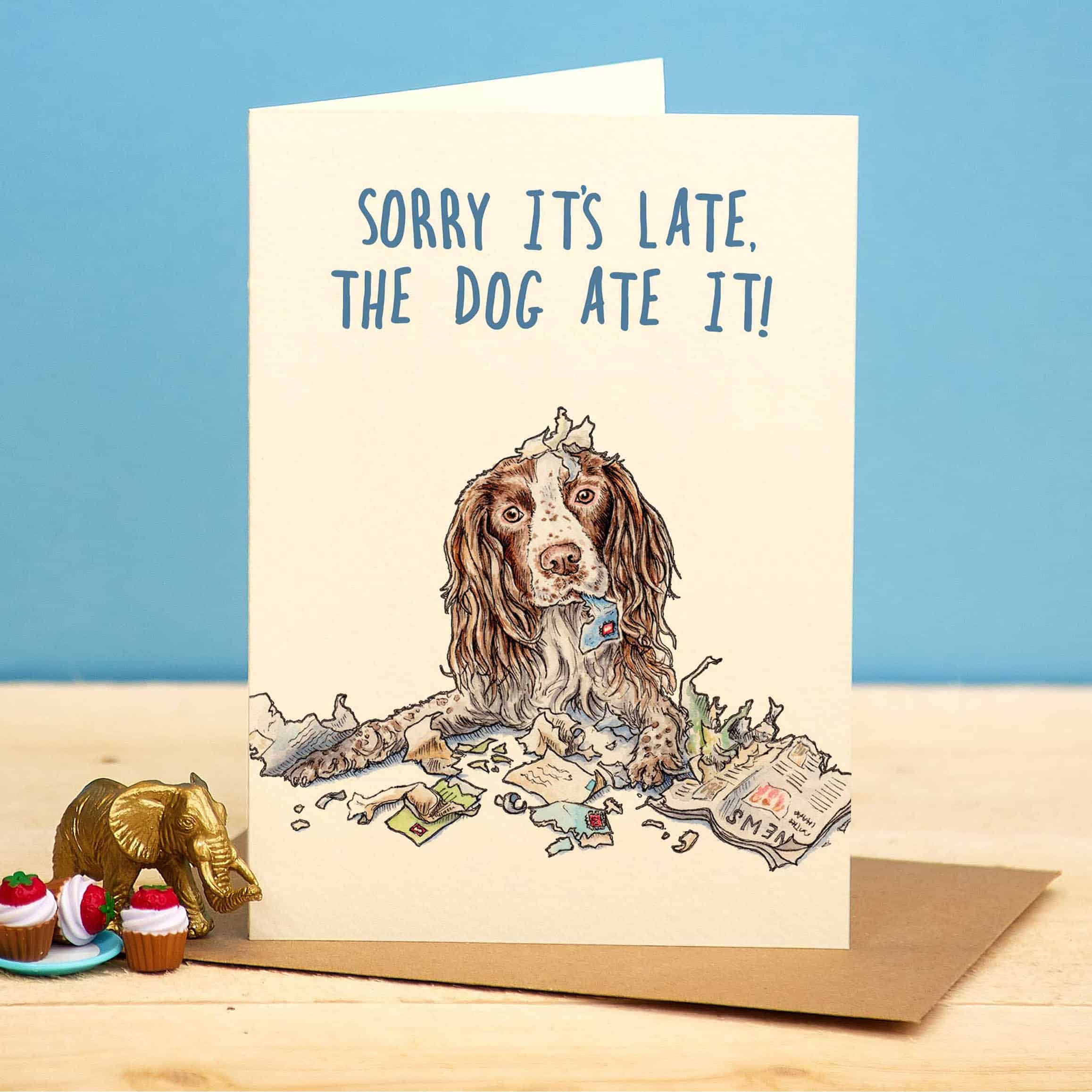 Card with a dog illustration and text 'Sorry it's late, the dog ate it!' on a blue background