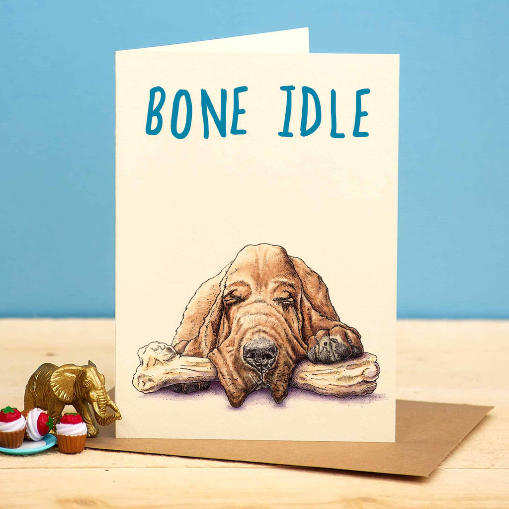 Card with a dog illustration and 'Bone Idle' text on a blue background
