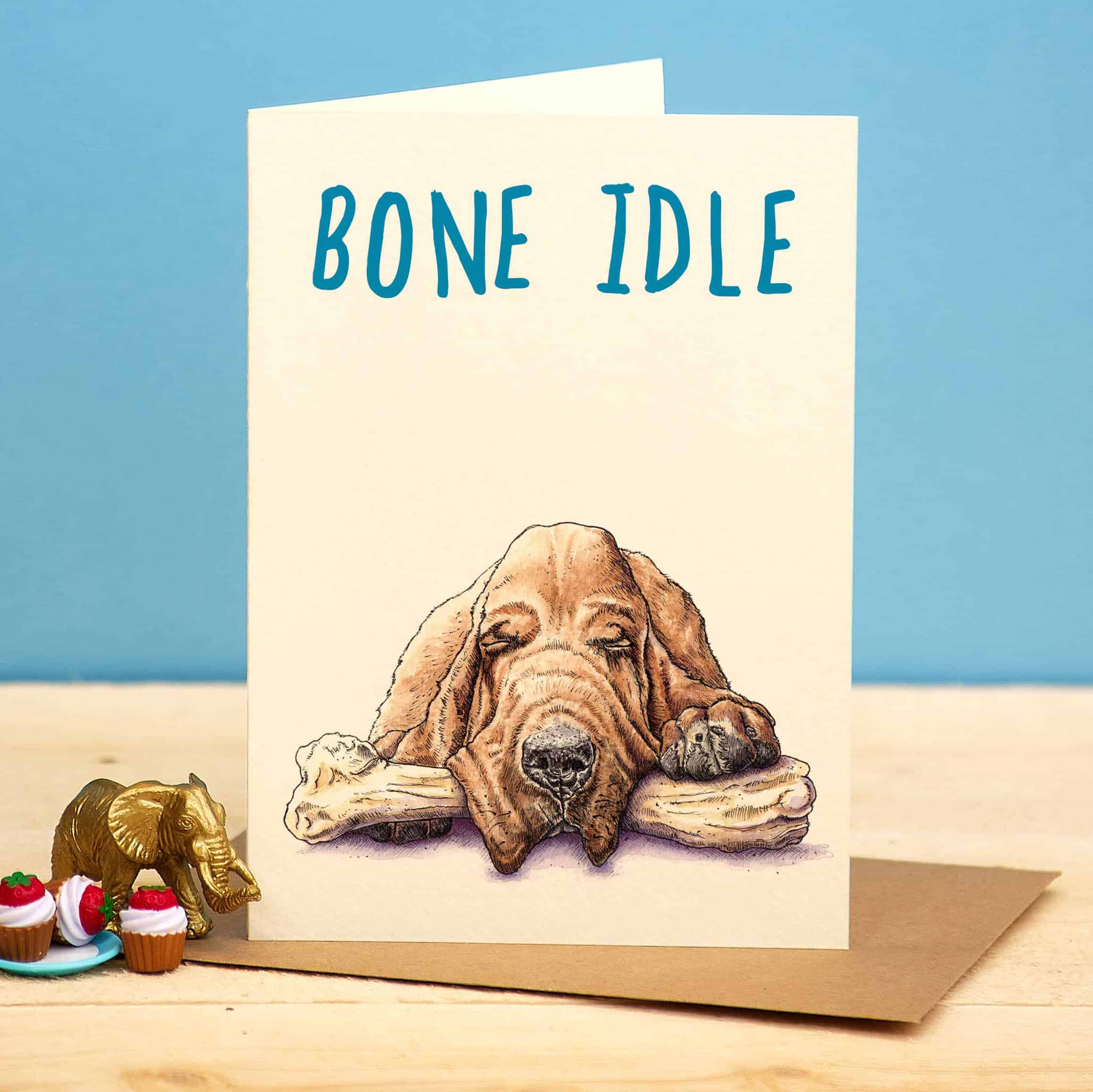 Card with a dog illustration and 'Bone Idle' text on a blue background