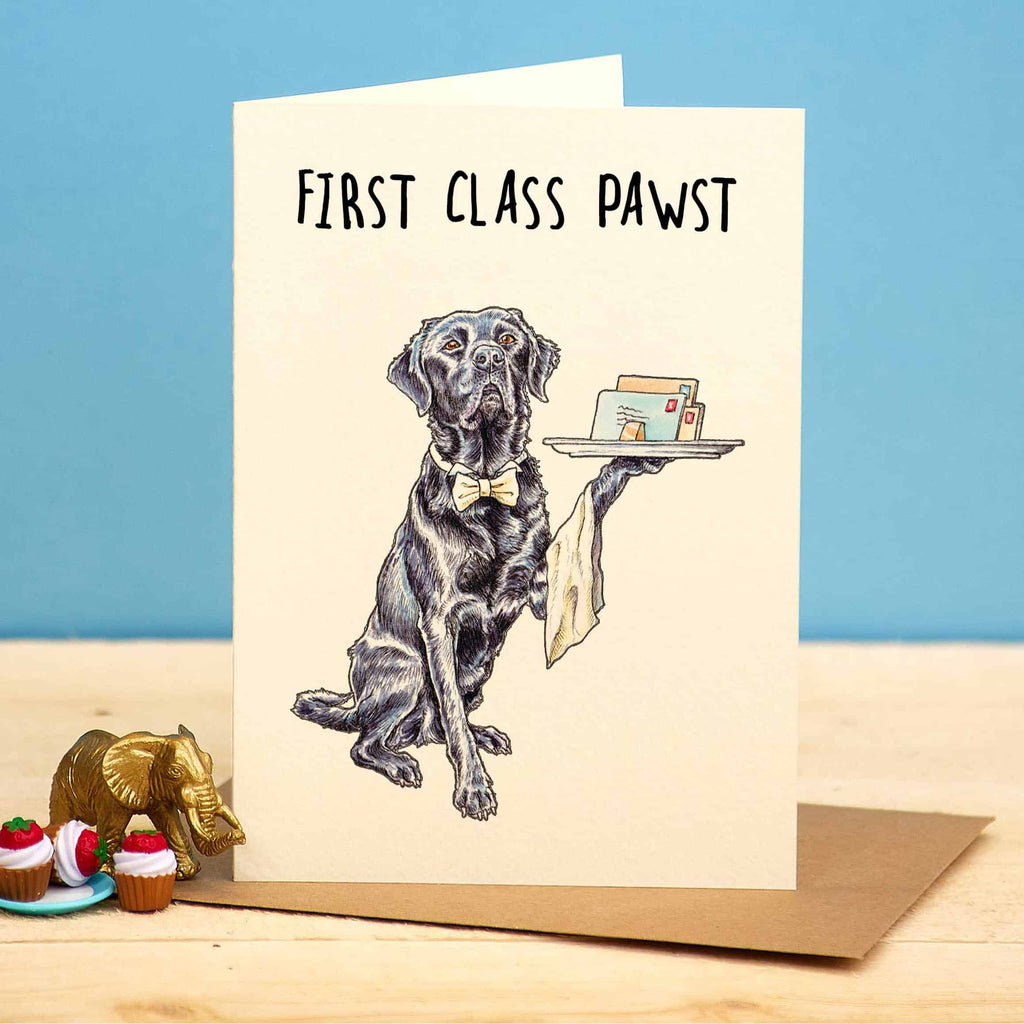 Greeting card with a dog illustration and text 'First Class Pawst' on a blue background