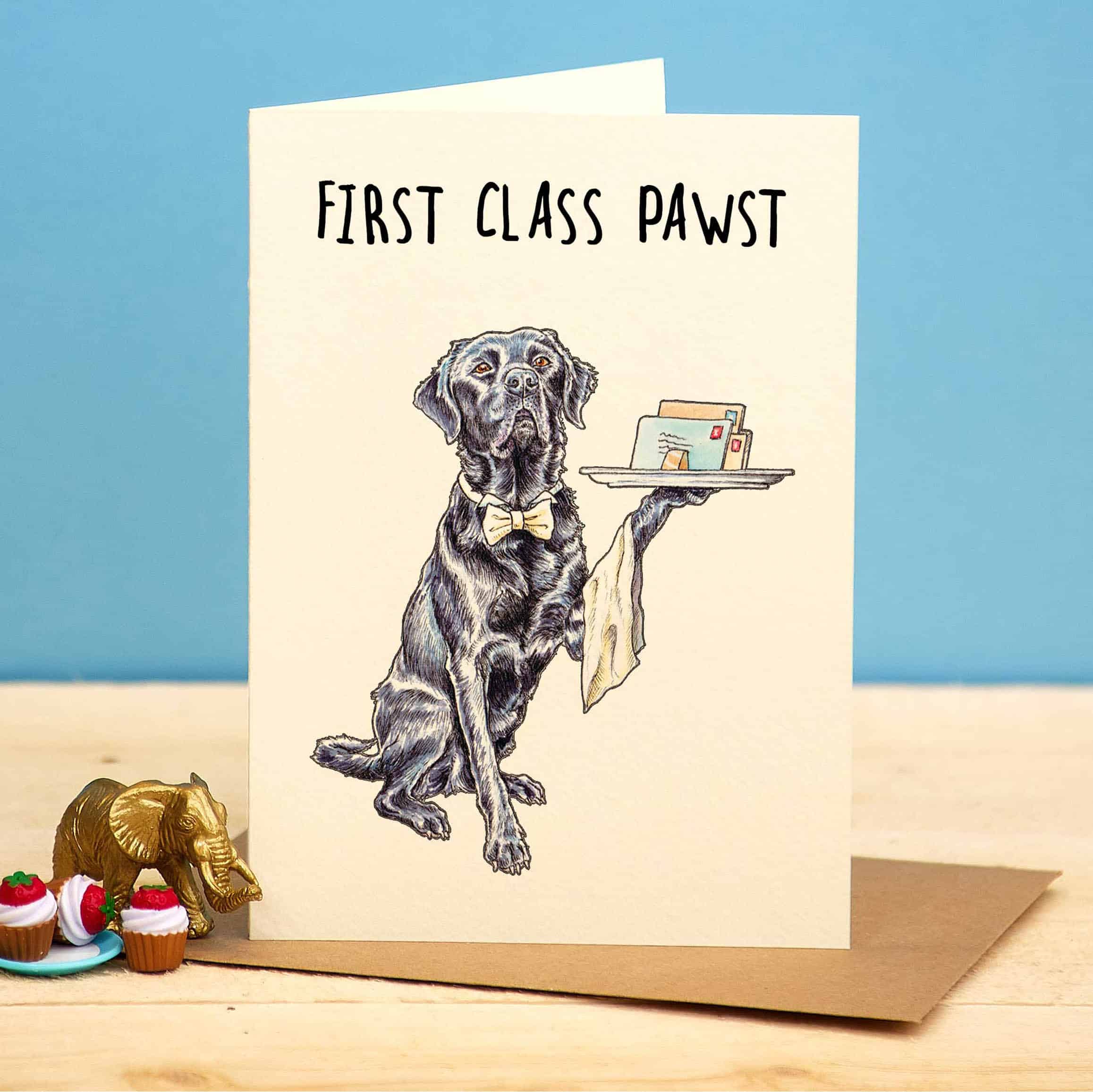 Greeting card with a dog illustration and text 'First Class Pawst' on a blue background