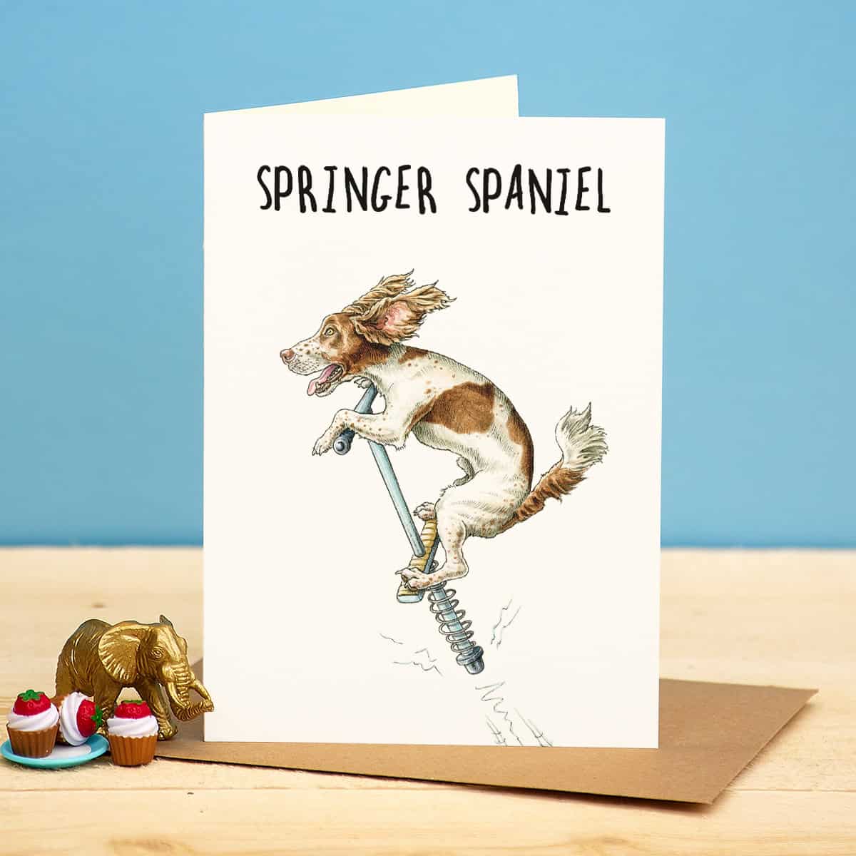 Greeting card with a Springer Spaniel illustration on a blue background