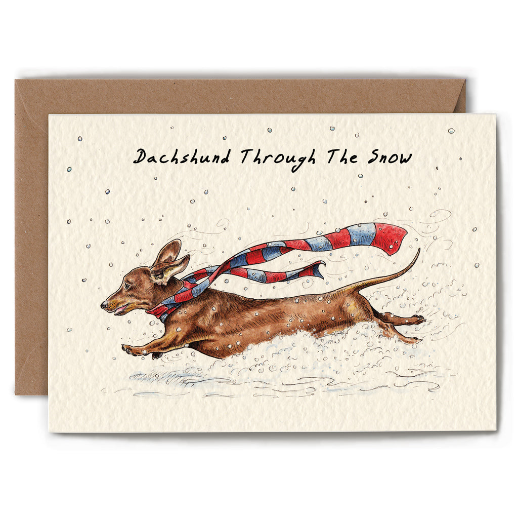 Greeting card with a dachshund illustration wearing a scarf in the snow, with a brown envelope.