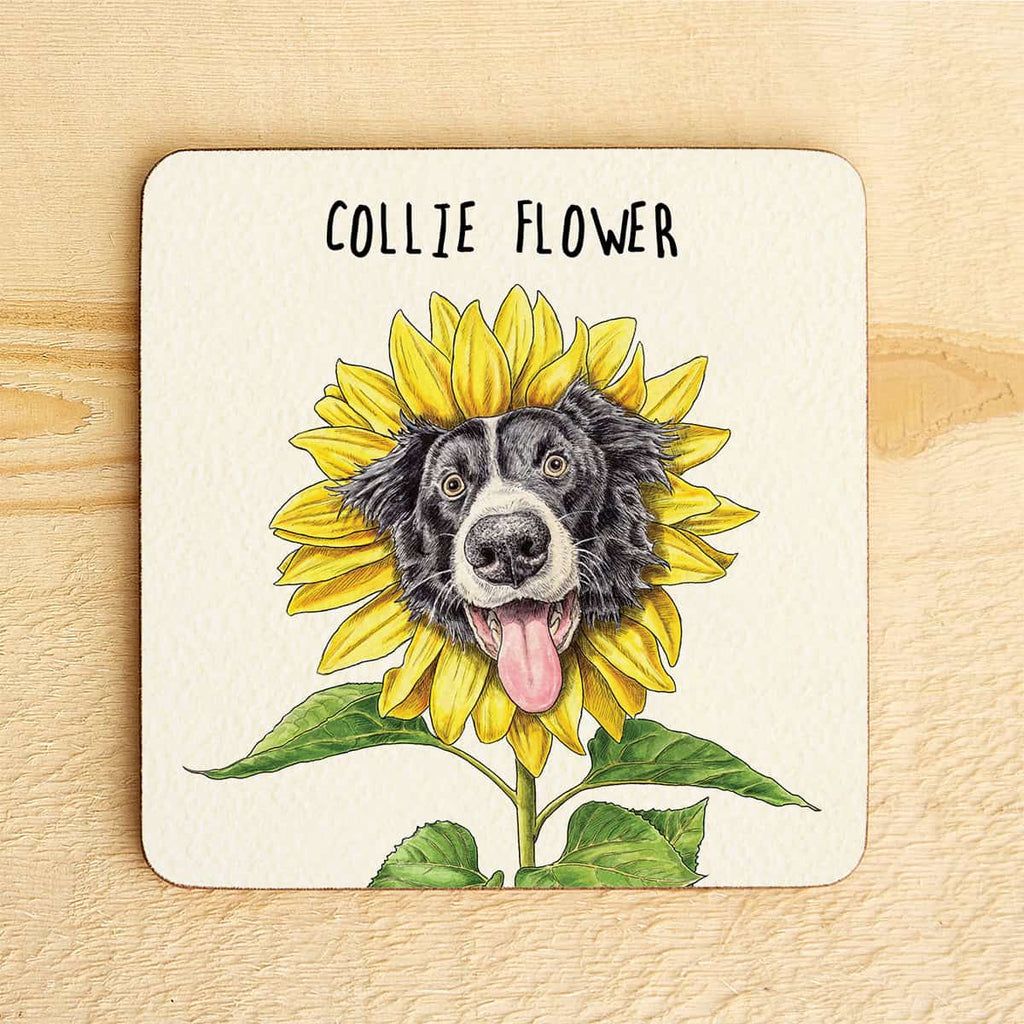 Coaster with a design of a Collie dog face surrounded by sunflower petals on a wooden surface.