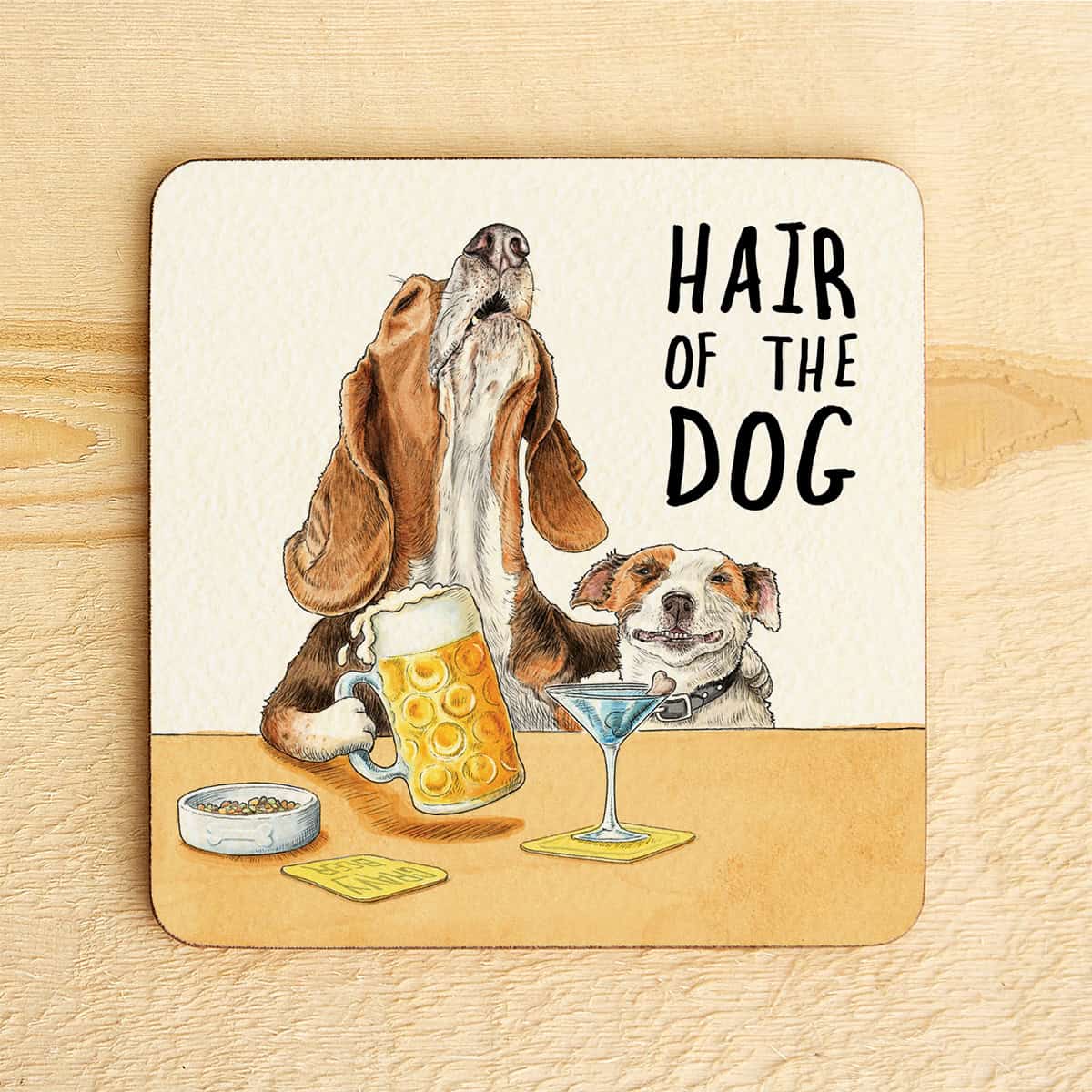 Coaster with illustration of dogs and drinks on a wooden surface