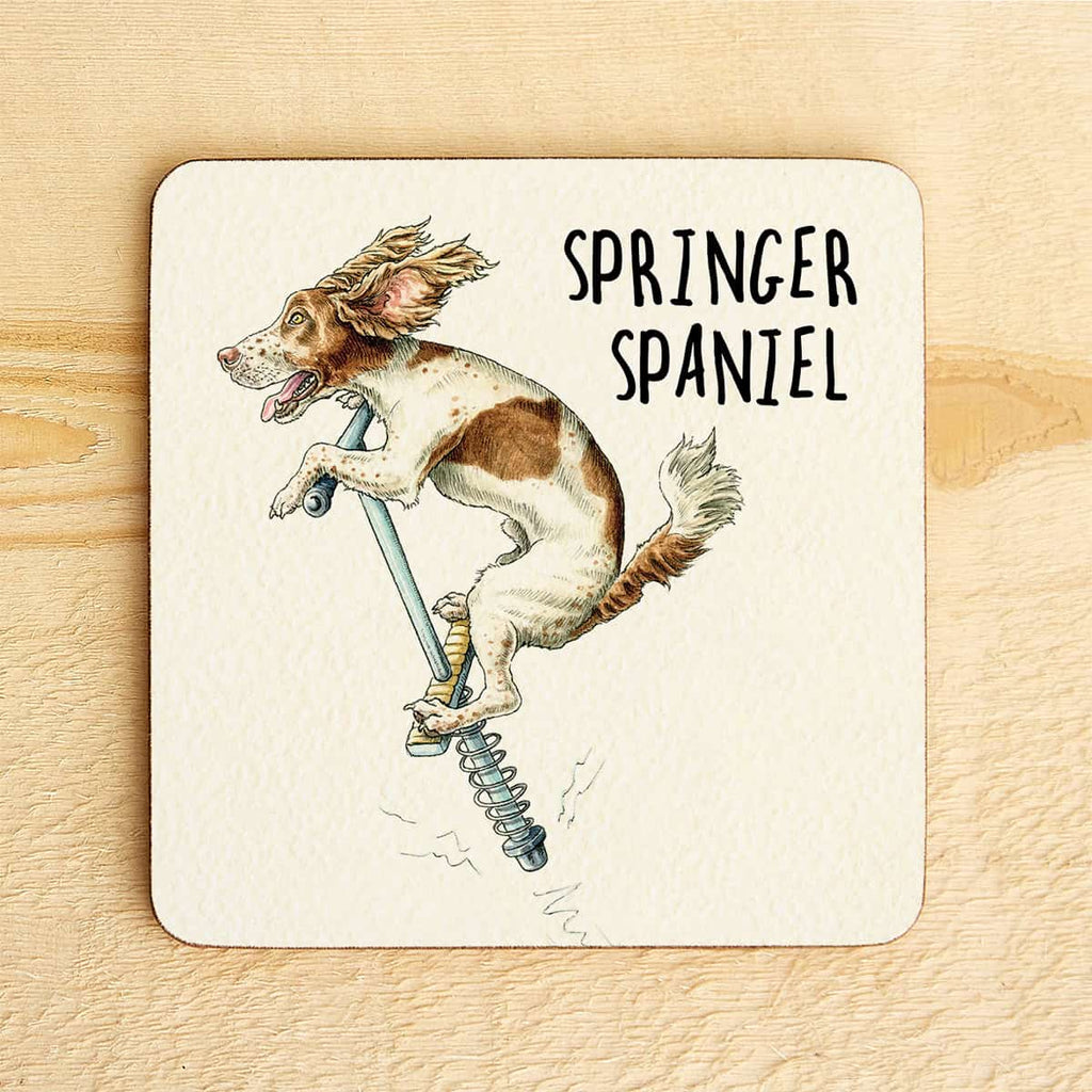 Coaster with a Springer Spaniel illustration and text on a wooden surface