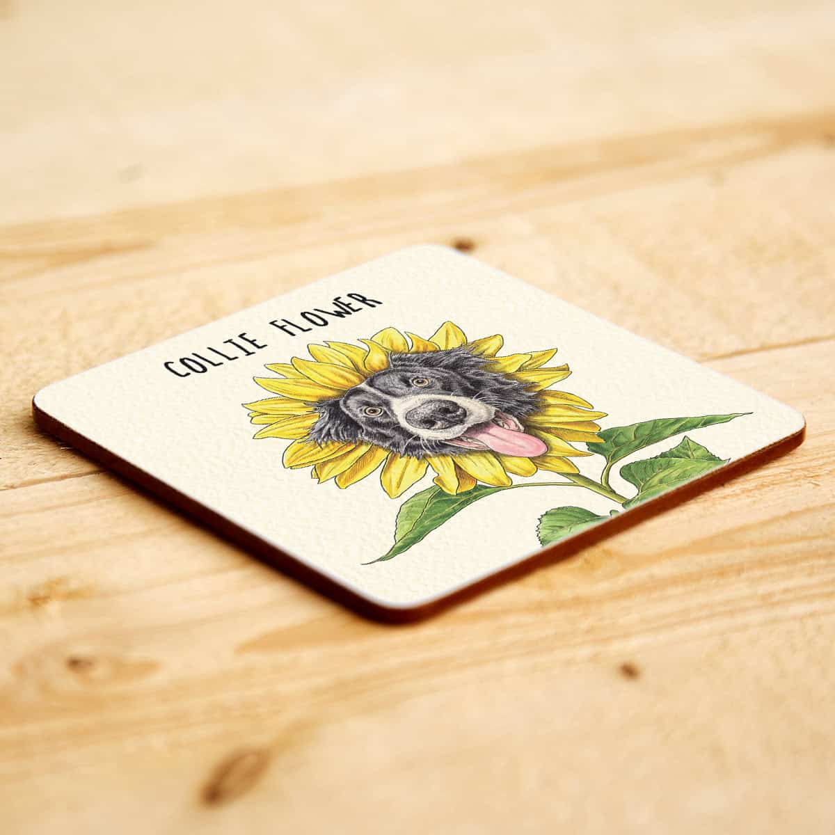 Coaster with a Collie dog illustration and sunflower on a wooden surface