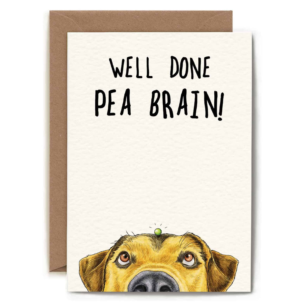 Greeting card with a dog illustration and text 'Well Done Pea Brain!' on a white background.