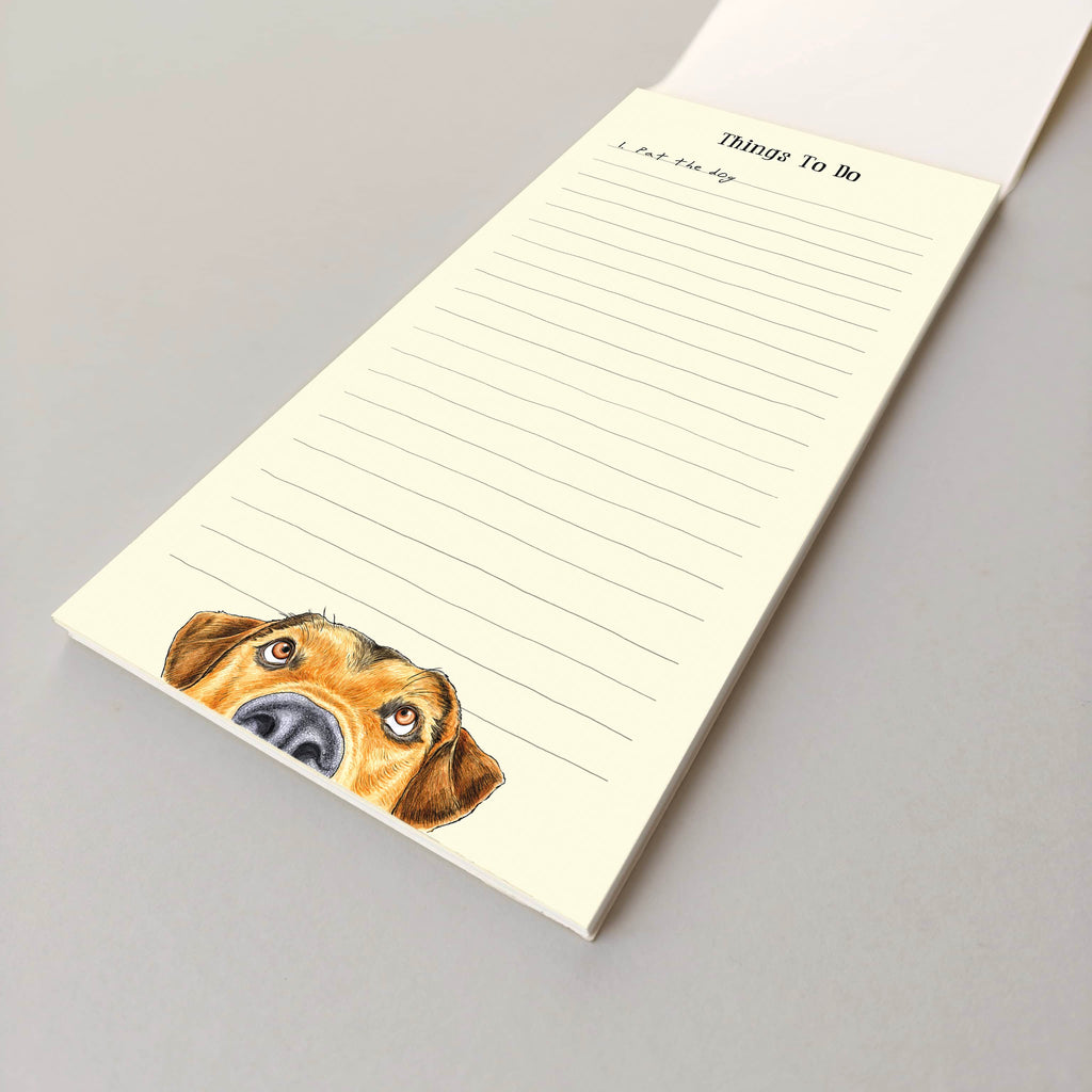 Notepad with a dog illustration on a gray background