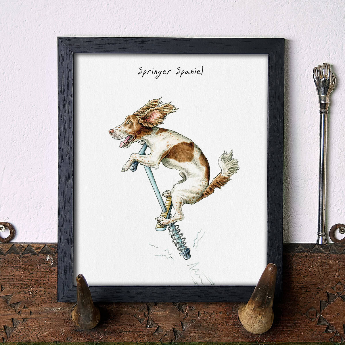Illustration of a Springer Spaniel jumping on a pogo stick on a white background