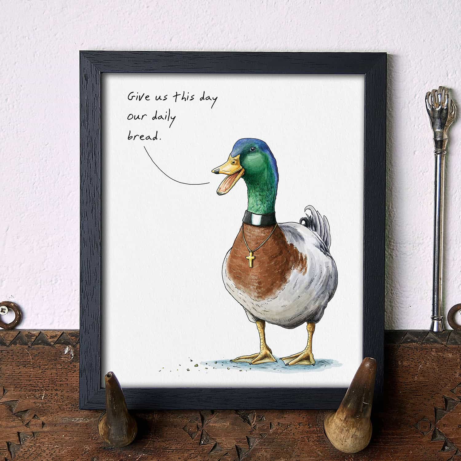 Illustration of a duck with text on a white wall.