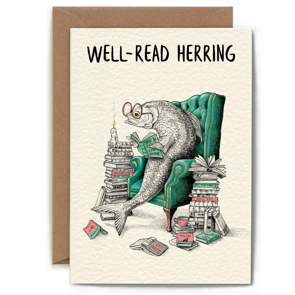 Greeting card with a fish reading a book, sitting on a chair with books around it, and the text 'Well-Read Herring' on a beige background.