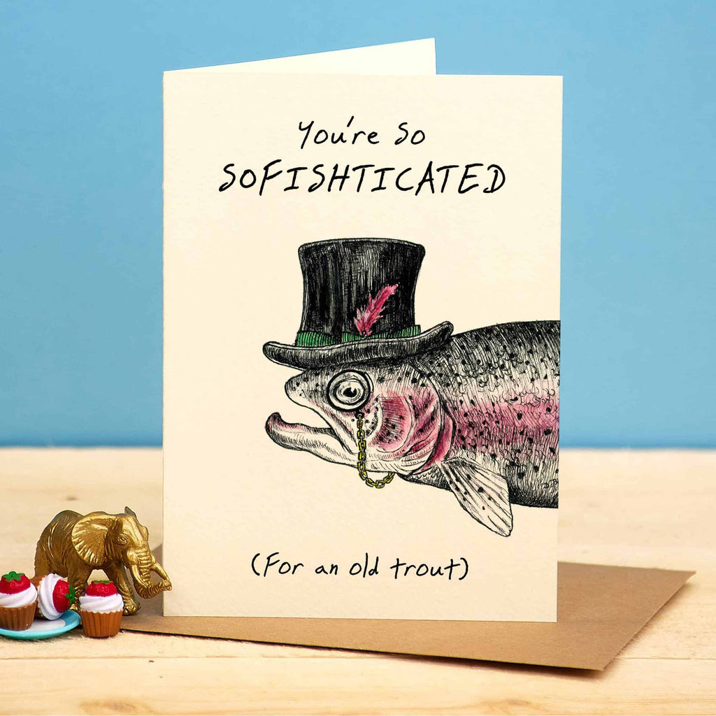 Card with fish wearing a top hat and text 'You're so sofishticated (For an old trout)' on a blue background.