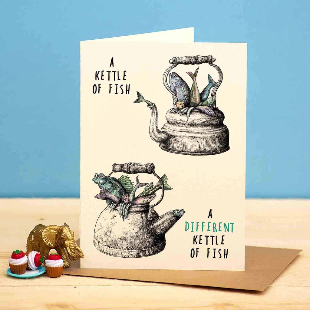 Greeting card with illustration of a kettle of fish on a beige background