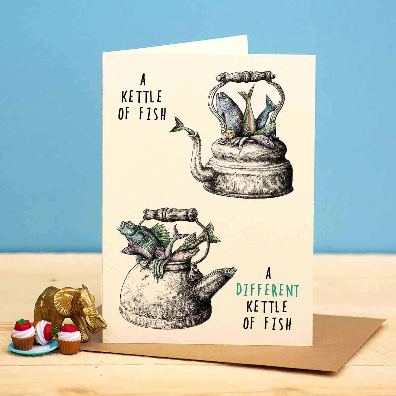 Greeting card with illustration of a kettle of fish on a beige background