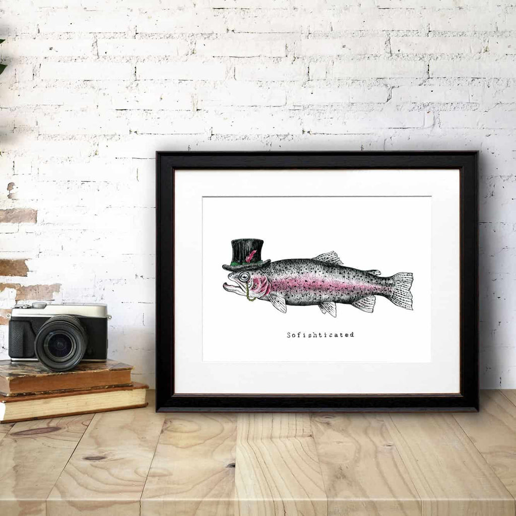 Print of a fish wearing a top hat displayed in a black frame