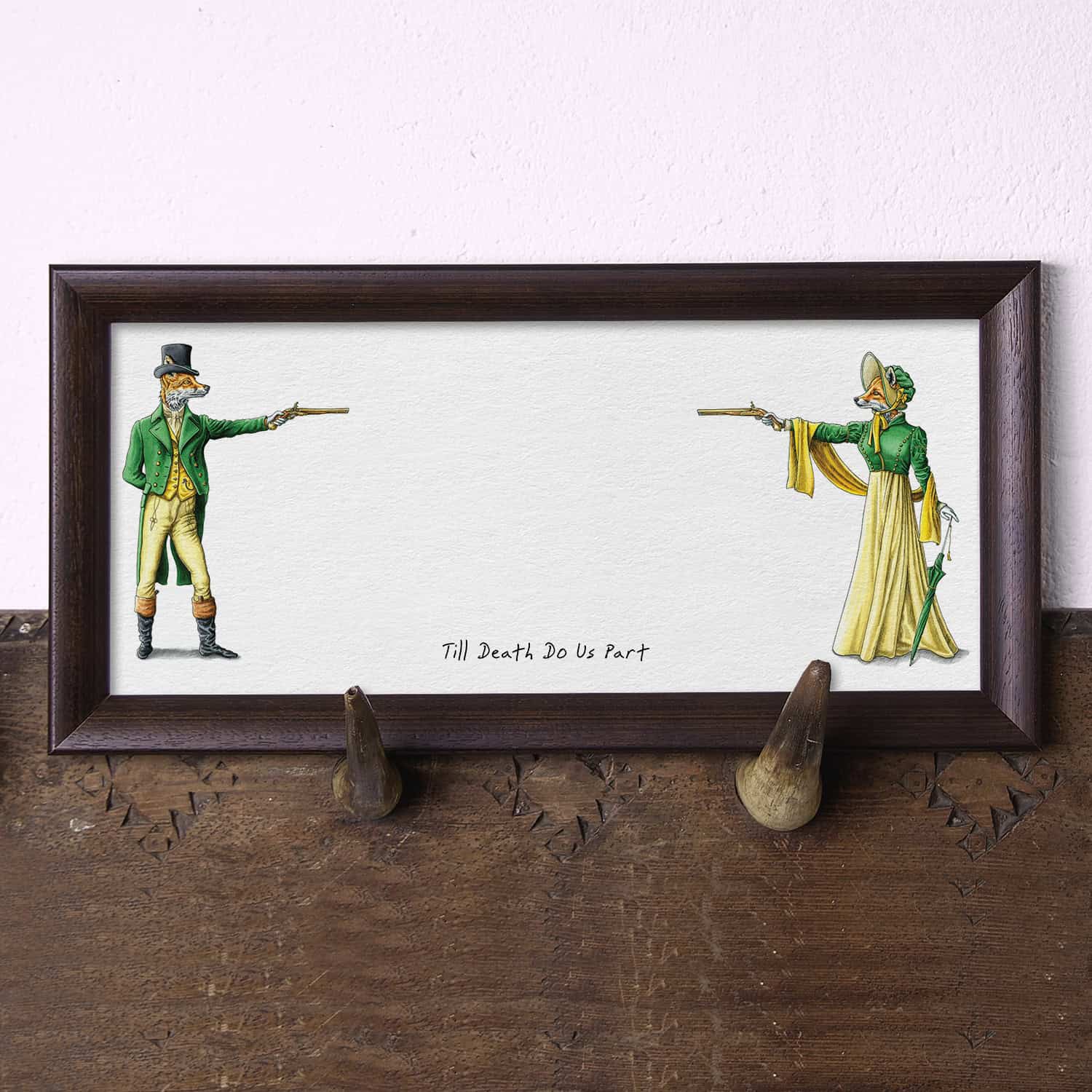 Artwork of two fox figures in green and yellow outfits with a humorous quote on a wooden surface.