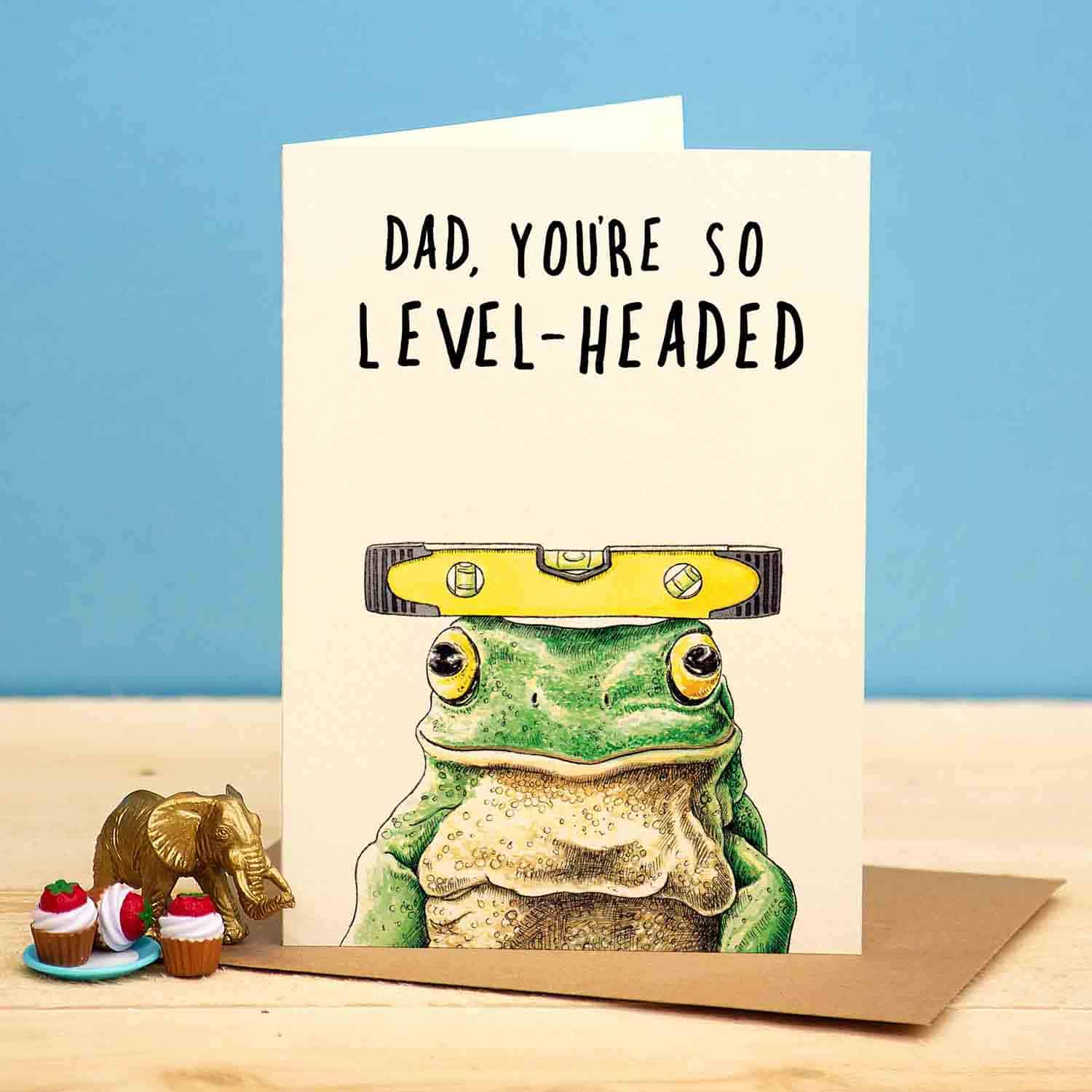 Card with a frog wearing a level hat and text 'Dad, you're so level-headed' on a blue background.
