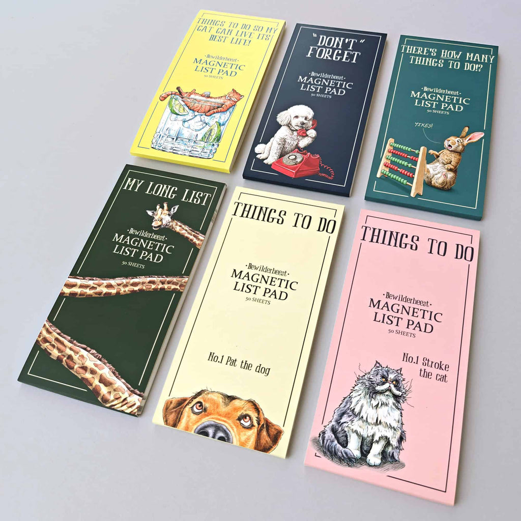 Set of colorful magnetic list pads with animal illustrations on a gray background