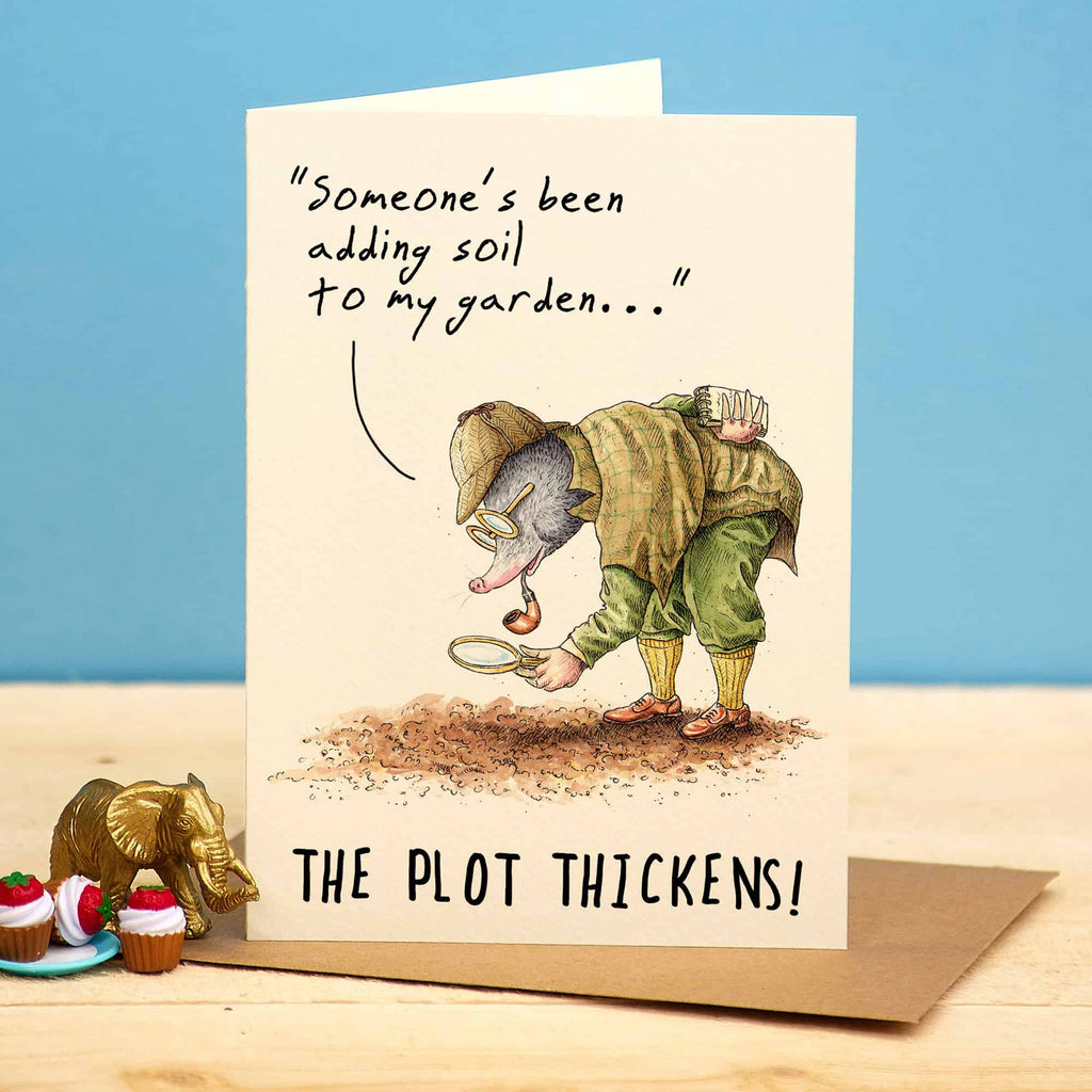 Greeting card with a mole character digging in the dirt and text 'Someone's been adding soil to my garden.