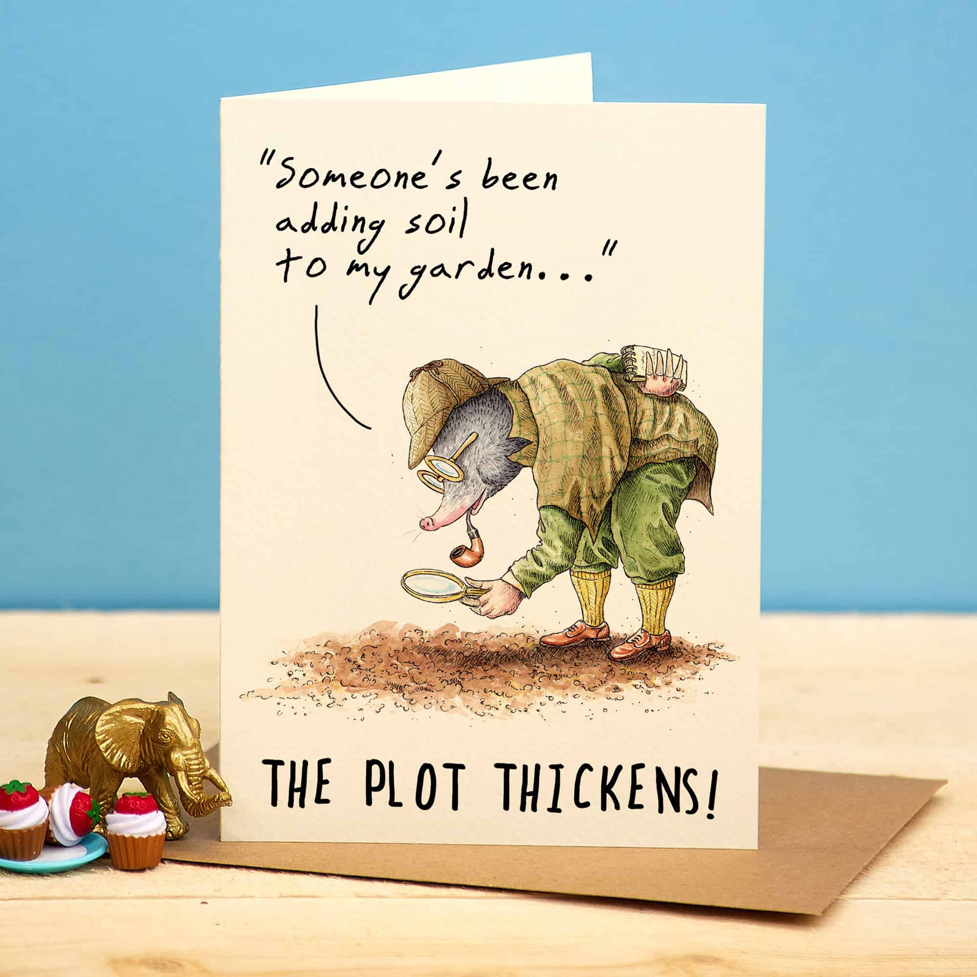 Greeting card with a mole character digging in the dirt and text 'Someone's been adding soil to my garden.