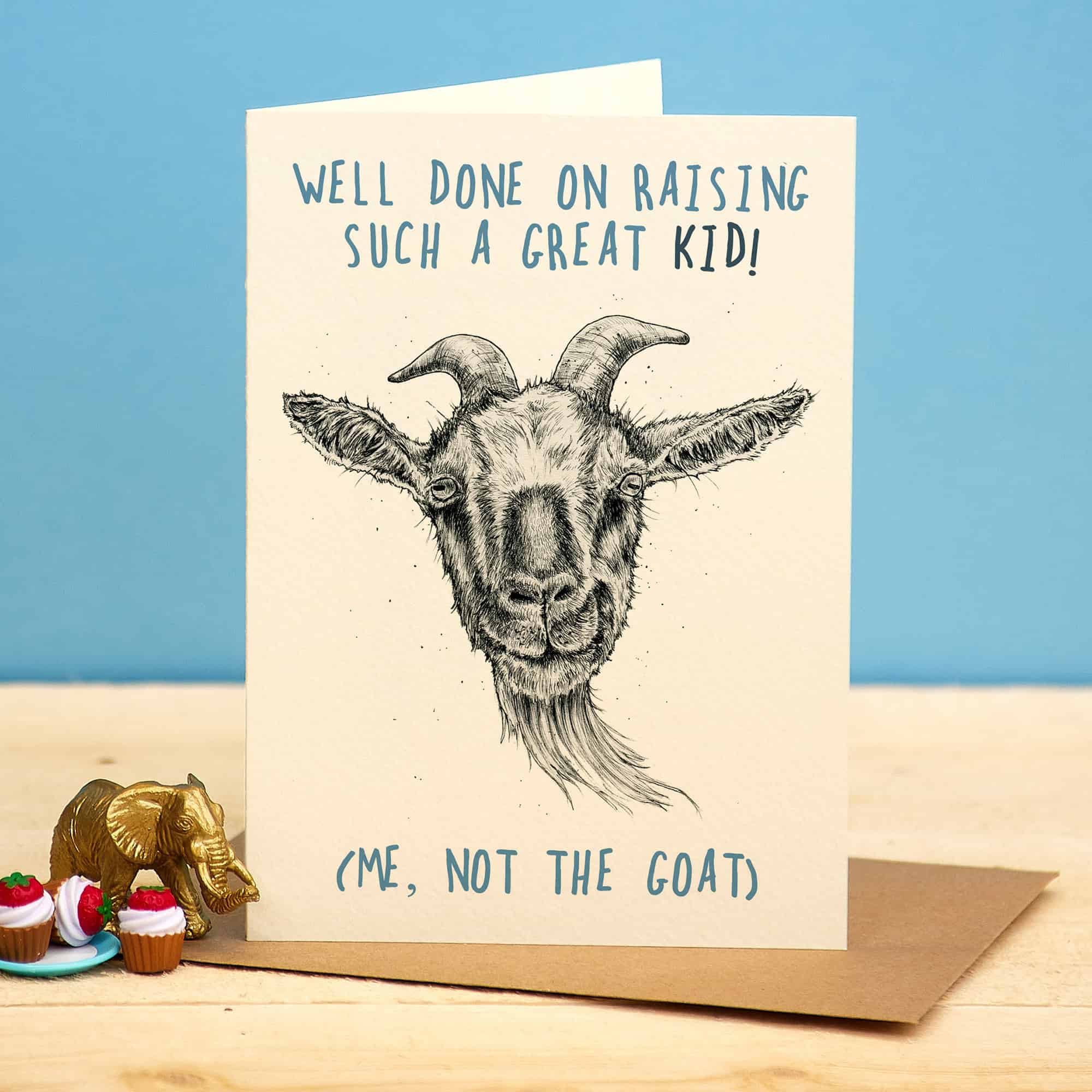 Greeting card with a goat illustration and humorous text on a blue background
